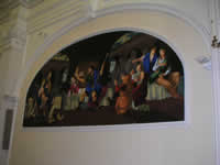 Il grande dipinto sulla destra della chiesa di S. Rocco