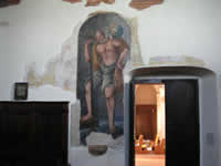 Un dipinto venuto alla luce duranti i lavori di restauro della chiesa al di sotto degli intonaci. Mostrerebbe Mosè che porta Gesù.